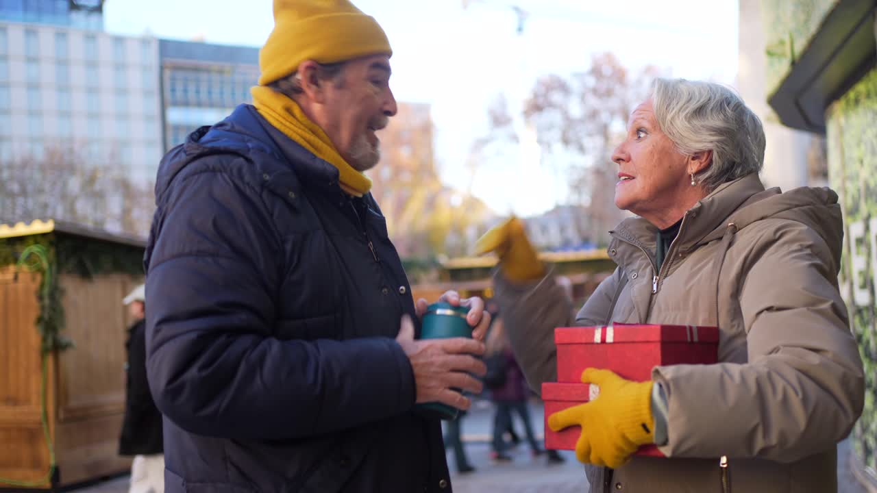 Senior Couple Exchanging Gifts Outdoors