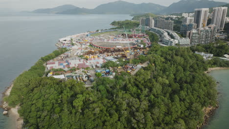 panoramic drone shot of a construction site in hong kong next to the sea