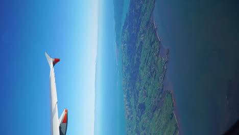 Tail-of-an-airplane-flying-on-the-blue-sky-with-different-light-conditions