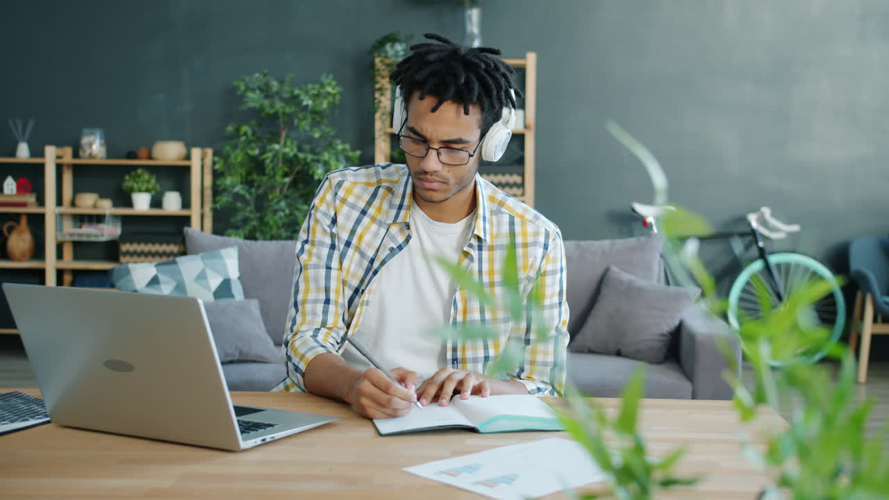 Man Studying Online from Home