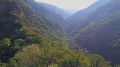 flight over green mountains and rocks