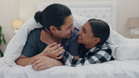 Love,-kiss-and-a-couple-laughing-in-bed