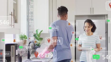 receiving social media notifications, couple in kitchen