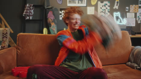 excited sports fan watching tv game at home and cheering after victory