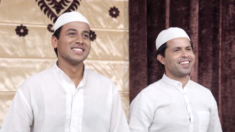 happy indian muslim men smiling