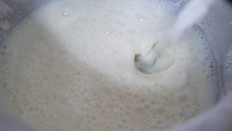 milk pouring into a bowl