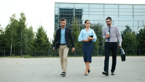 business people walking and talking