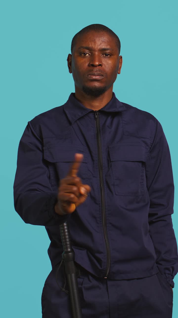 African American Security Guard Gesturing No with Finger