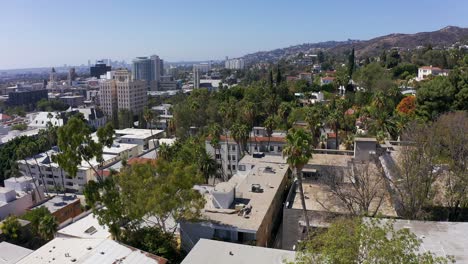 Low-aerial-panning-shot-across-Hollywood-towards-West-Hollywood-and-Century-City-in-Los-Angeles,-California