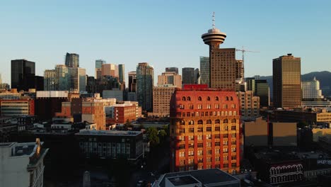 aerial drone footage of downtown vancouver buildings, gas town, early sunrise, morning urban view