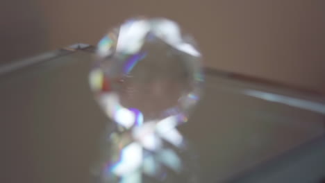 macro rack focus push in onto crystal on reflective glass