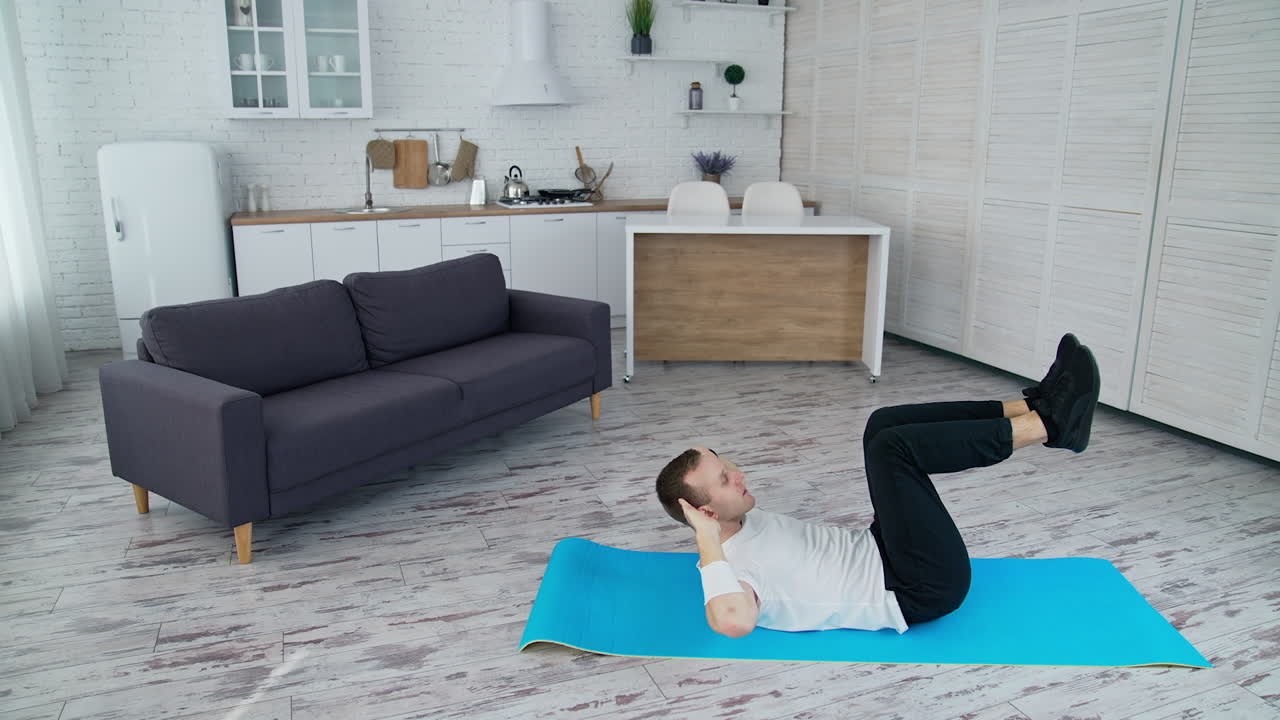 Man training indoor on lockdown time. Sporty lifestyle active man training his body.