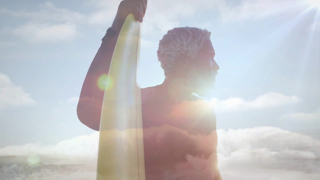Male surfer holding surfboard scanning horizon after spotting wave, animated flares following gaze