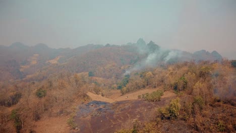 smog of forest fires. deforestation and climate crisis. toxic haze from rainforest fires, thailand, ma hon son. aerial video 4k