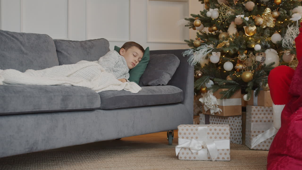 Child Sleeping While Santa Arrives