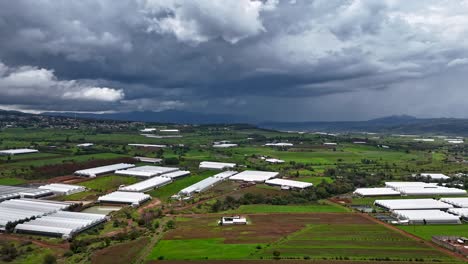 dramatic storm clouds hyperlapse over mexican farmland