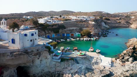 Aerial-Reveal-Mandrakia-small-fishing-village-Milos-Island,-Greece