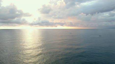 Two-small-boats-headed-to-the-harbour-of-Quepos,-Costa-Rica-during-sunset