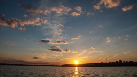 romantic colorful sunset on the sea. against the background of the sea, the sun sets, blue and orange clouds flow in the sky. majestic summer landscape. landscape sunset time lapse, video loop