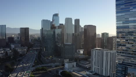 static aerial drone shot of downtown los angeles on sunny summer day