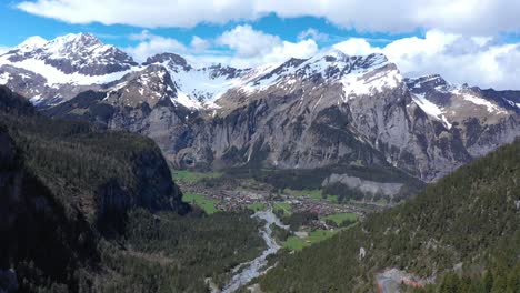 Drone-flight-over-a-beautiful-alpine-glacier-valley-and-vast-mountainous-landscape