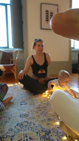 family yoga session with baby