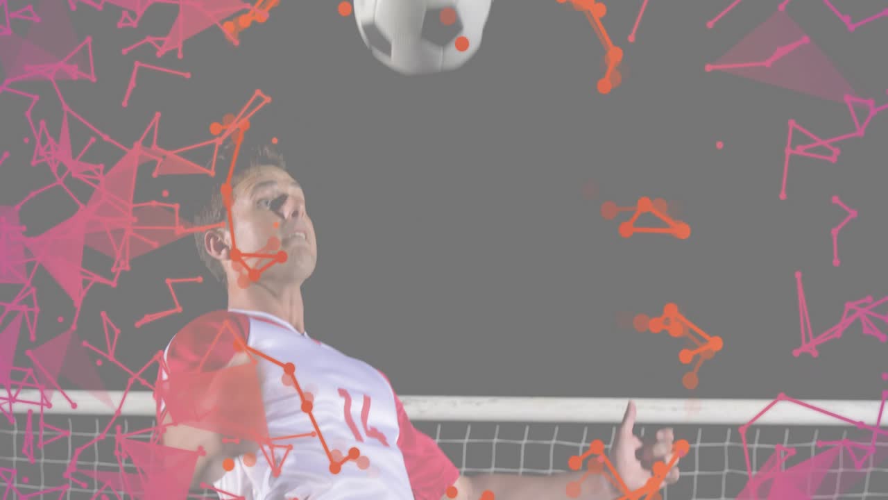 Male athlete tracking incoming ball and executing header while training with red magenta overlay