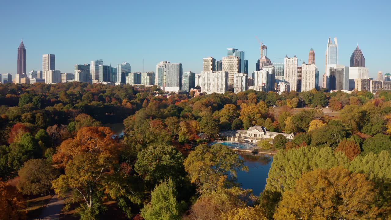 Slowly gliding over Piedmont Park viewing downtown Atlanta Georgia in the Fall