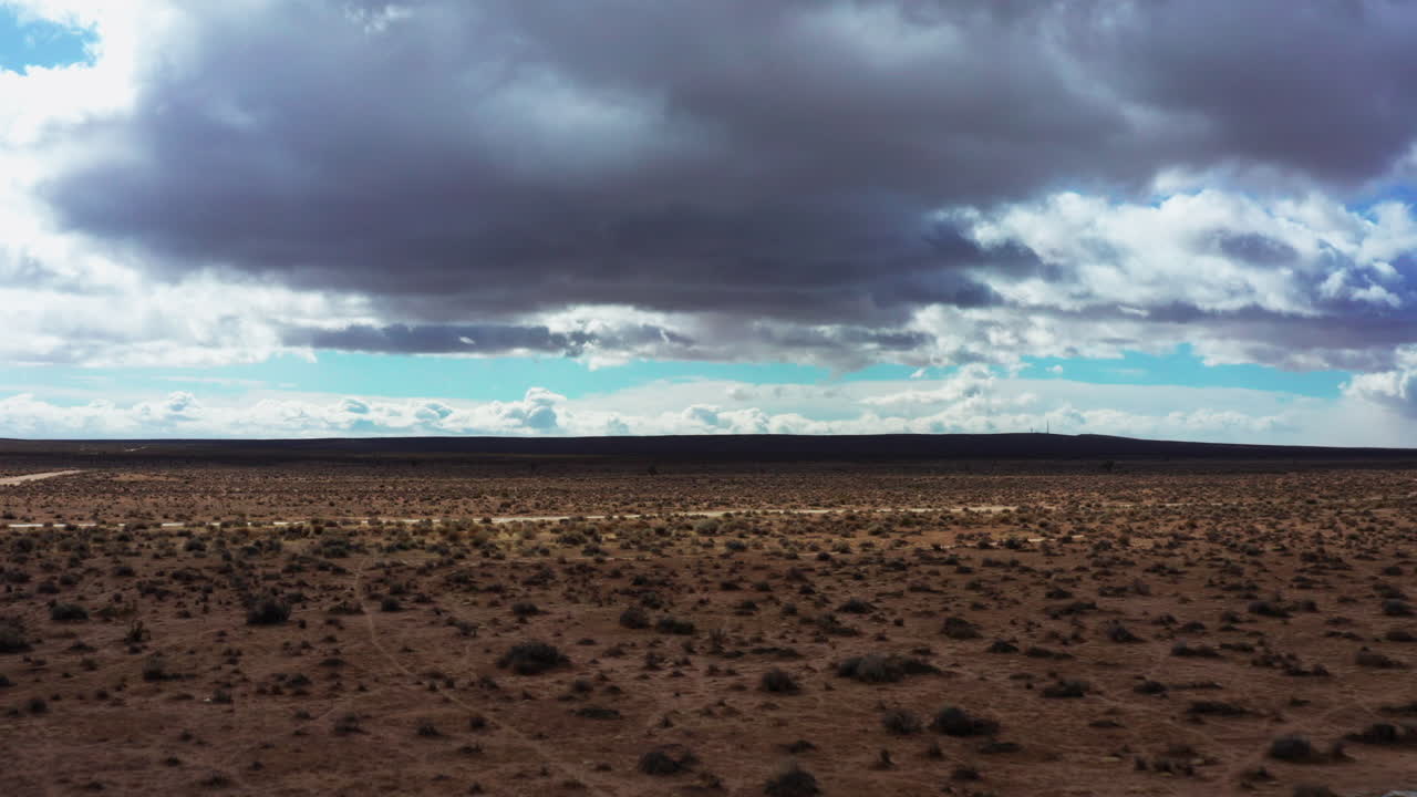 Aerial view of the arid and barren wilderness of the Mojave Desert in Southern California on a cloudy day