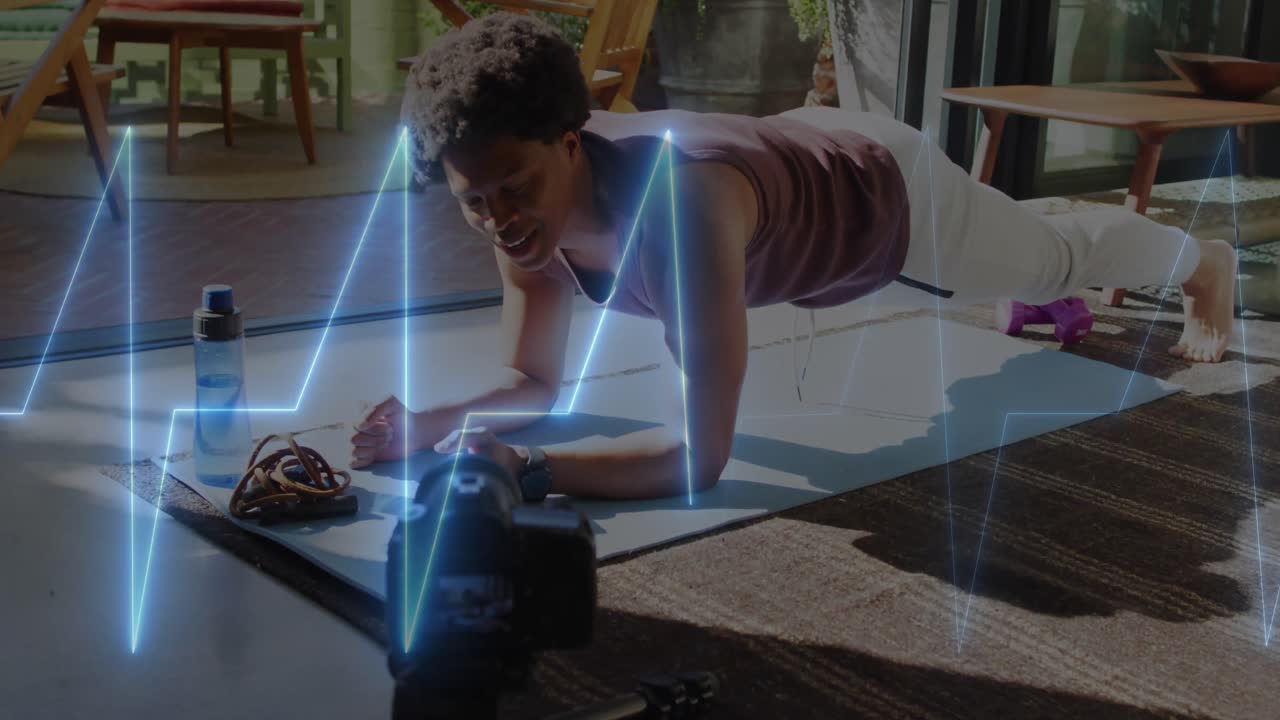 animación de ritmo cardíaco de neón sobre hombre afroamericano haciendo tabla