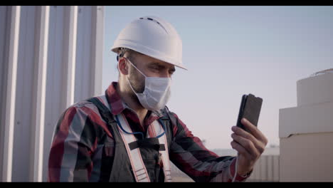 construction worker on rooftop video call