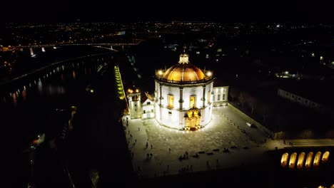 Nighttime-Drone-shots-of-the-Douro-River-in-the-heart-of-Porto,-Portugal