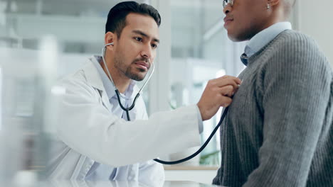 doctor, man and listening with stethoscope to