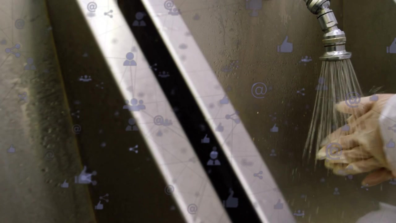 Gloved hands pressing PUSH dispenser turning faucet rinsing for hygiene while social icons drifting