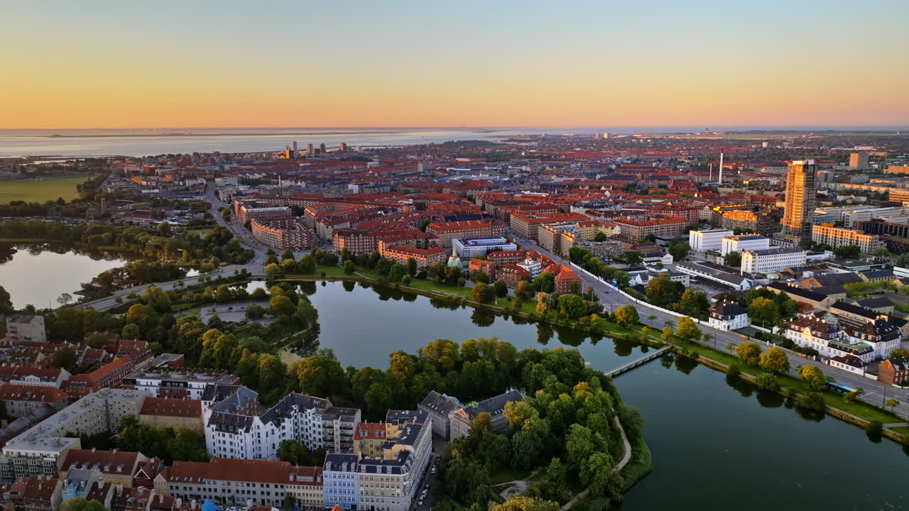 Aerial drone view of the city centre of Copenhagen, Denmark at sunset