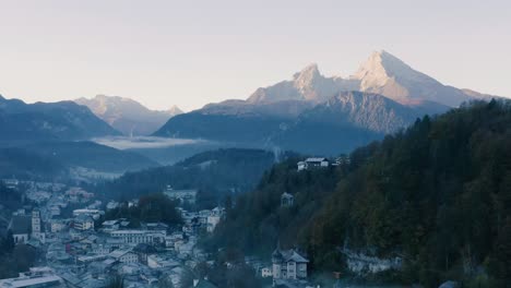 autumn landscape in bavaria, germany | 4k uhd d-log - cold, misty sunrise fall colours over berchtesgarden germany, featuring a cinematic drone shot of the town and mountains