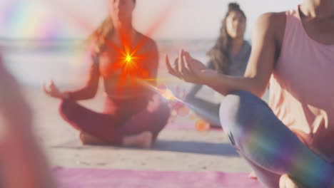 on beach, women practicing yoga with colorful animation light effects