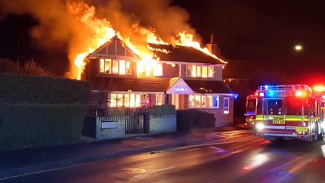 a fire truck is parked in front of a house on fire