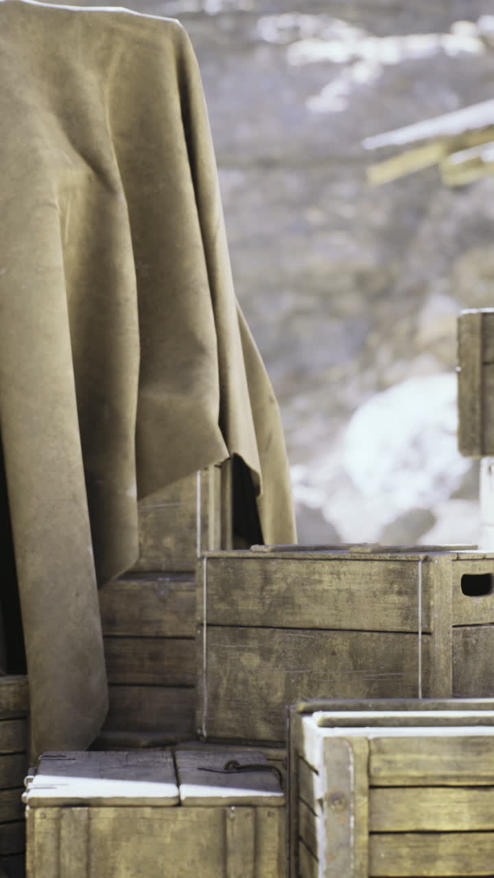 Wooden crates covered with a cloth in a rustic outdoor setting
