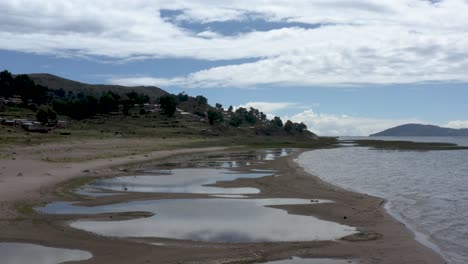 Aerial-low-view-of-a-beautiful-beach-in-lake-Titicaca