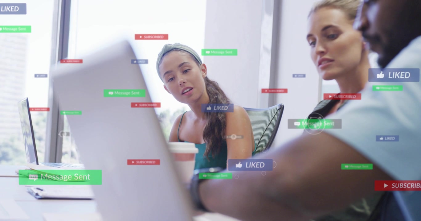Man using laptop trackpad women leaning in generating animated social overlays for marketing