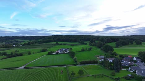 Skies-of-different-blues,-landscape-of-greens-and-buildings