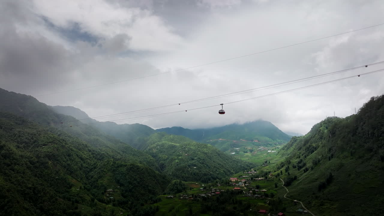 Fansipan Sun World cable car gondola ascending towards summit, Hoang Lien. Drone
