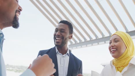 happy diverse business people celebrating at office, slow motion