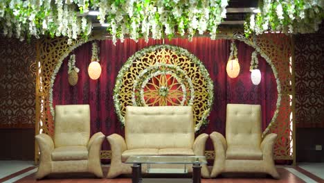 An-amazing-shot-of-a-gorgeous-stage-set-up-at-a-traditional-Asian-wedding-with-a-stunning-red-and-golden-theme