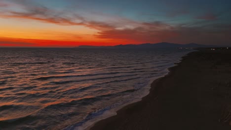 sandy beach waves by sunset
