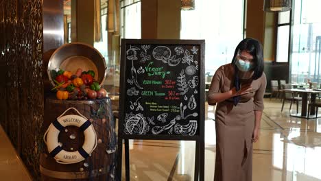 a lady working in a five-star hotel welcoming tourists slow-mo 4k