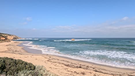 waves gently hitting the sandy beach