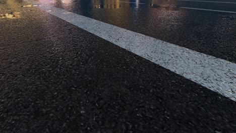 3d heavy rain hitting road at night - 4k realistic rain particle (loopable) - rainy day on a colorful street with traffic - wet road at night - low angle shot of in the rain - rainfall and reflection on road - loopable moving image - cuba - havana