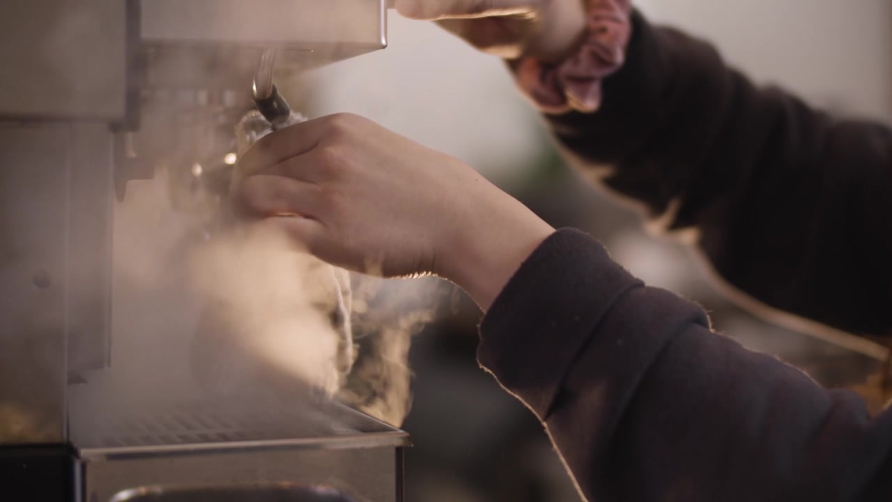 Barista Clearing Steam Wand Close Up